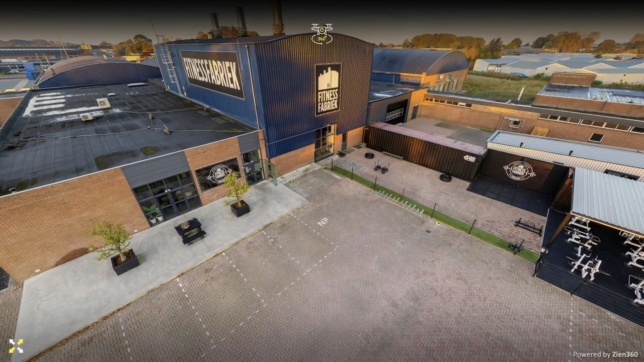 Drone view of Fitness Fabriek Dokkum showing the building, grounds and large façade lettering