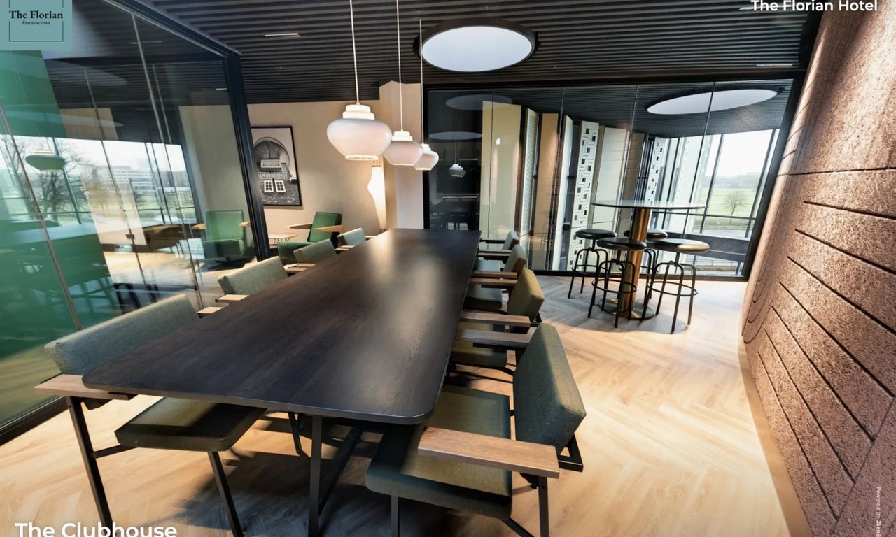 The Clubhouse at The Florian Hotel with a long table, lounge seating and a view