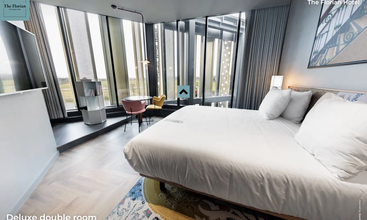 Deluxe Double Room at The Florian Hotel with a double bed and large windows